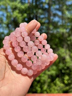 Bask in the gentle, loving energy of Rose Quartz, a crystal celebrated for its soft pink hue and nurturing properties. Known as the stone of unconditional love, Rose Quartz is perfect for enhancing emotional healing, fostering self-love, and inviting a deep sense of peace and compassion. Its calming vibrations help to soothe the heart, ease tension, and create a loving atmosphere. Keep Rose Quartz close to attract love, nurture your spirit, and fill your space with serene, positive energy. A timeless gem for those seeking to cultivate a heart full of warmth and tranquility. 🌸💖 Pink Rose Quartz Bracelet For Meditation, Pink Rose Quartz Bracelets For Meditation, Pink Rose Quartz Round Beaded Bracelets, Spiritual Rose Quartz Crystal Bracelet, Rose Quartz Round Crystal Bracelet Gift, Elegant Rose Quartz Crystal Bracelet For Meditation, Pink Rose Quartz Bracelets For Valentine's Day, Pink Spiritual Bracelets For Valentine's Day, Pink Beaded Bracelets For Meditation