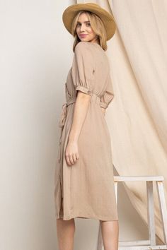 Elevate your wardrobe with our Asymmetrical Button-Down Wrapped Midi Dress, a true embodiment of timeless elegance and style. This dress offers a perfect blend of sophistication and modern flair, ensuring you'll look effortlessly chic and feel confident on any occasion. Key Features: Half-Sleeve Design: The dress features a half-sleeve with button closure, providing a touch of modesty and versatility. You can adjust the sleeves to your preference, making it suitable for various weather condition Beige Fitted Midi Dress With Asymmetrical Hem, Elegant Button-up Midi Dress With Tie Waist, Fitted Midi Dress With Button Back, Classic Fitted Midi Dress With Tie Waist, Fitted Knee-length Midi Dress With Button Back, Chic Belted Midi Dress With Asymmetrical Hem, Chic Midi Dress With Belted Asymmetrical Hem, Elegant Solid Maxi Dress With Button Closure, Elegant Solid Color High-low Hem Dress