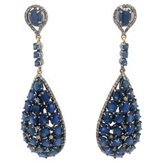 A gorgeous pair of earrings set in silver, with a 2.40-carat diamond and a natural 24.12-carat blue sapphire. Sapphire And Diamond Earrings, Diamonds Earrings, Natural Blue Sapphire, Earrings Set, Blue Sapphire, Earring Set, Jewelry Earrings Dangle, Diamond Earrings, Dangle Earrings