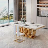 a dining room table with two chairs in front of a large window overlooking the ocean