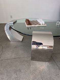 a glass table topped with a piece of cake