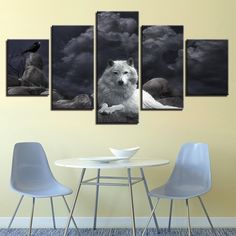 a white dog sitting on top of a table in front of a black and white sky