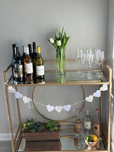 a bar cart filled with bottles and glasses