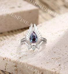 a close up of a ring with a blue stone