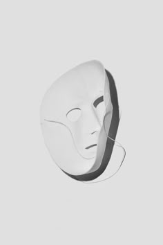 a white mask is shown against a gray background