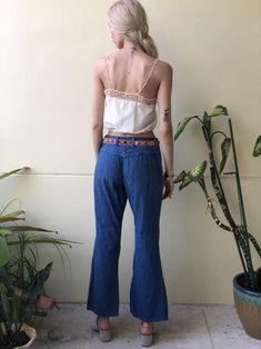 "1980's Wranglers in a perfect low rise boot cut. for the belt also photographed, go here: https://www.etsy.com/listing/667946771/295-33-waist-belt-vintage-leather-beaded?ref=shop_home_active_2 for the antique blouse also photographed, go here: https://www.etsy.com/listing/654105288/antique-crop-top-white-crochet-cropped?ref=listing_published_alert Waist: tight 30.5\" Hips: 44\" Inseam: 30\" Rise: 11\" Circa: late 1970's early 1980's Condition: Good vintage condition. Normal wear, nothing to not Hippie Straight Leg Summer Bottoms, Blue Flare Jeans For Summer Festival, Mid-rise Flare Jeans With Belt Loops For Summer, Mid-rise Summer Flare Jeans With Belt Loops, Vintage Fitted Flare Jeans For Summer, Summer Mid-rise Flare Jeans With Belt Loops, Bohemian Dark Wash High Waist Bottoms, Bohemian High Waist Dark Wash Bottoms, Vintage Medium Wash Cotton Bottoms