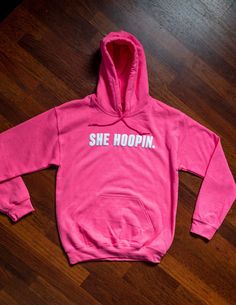 "The \"She Hoopin\" hoodie was inspired by the lady ballers. This hoodie was made to show love to the lady ballers out there who love the game of basketball! This hoodie feature a 3D puff text." Pink Cotton Sweatshirt For Fan Merchandise, Pink Casual Sweatshirt For Fan Merchandise, Sporty Hoodie For Game Day, Pink Era, Pink Basketball, Basketball Hoodies, Basketball Hoodie, Basketball Sweatshirts, Pretty Wallpapers Backgrounds