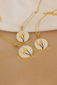 "✓ Personalized Flower Of Hair Keepsake Necklace For Women, Our Solid 925 Sterling Silver necklace with %100 hand crafted, gold workmanship is specially produced for you, Jewelry made with love for your special occasions. ---● N E C K L A C E  ∙  D E T A I L S ●--- * Pendant Diameter: 20 mm * The Chain and Pendant of the Necklace is SOLID 925 STERLING SILVER. * The pendant is made of UV stable resin. And your hair will be safe in it. * I can engrave any initial, name or numeral you want on the b Elegant White Necklace For Memorials, Elegant White Jewelry For Memorial, Elegant Hypoallergenic Jewelry For Memorials, Elegant Hypoallergenic Jewelry For Memorial, White Round Necklace For Memorial, White Round Necklaces For Memorial, White Memorial Necklace, Memorial Birth Flower Jewelry, Gold Hypoallergenic Flower Pendant Jewelry