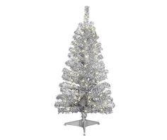 an artificial christmas tree with white lights on the top and silver branches, is shown in front of a white background