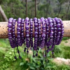 Discover the beauty and power of our handmade, adjustable Amethyst Macrame bracelet, designed to fit both men and women perfectly. Crafted with intention, this bracelet features Amethyst crystals, believed to be a powerful stone that provides protection, stress relief, and spiritual growth. As the February birthstone, it makes a meaningful gift for a loved one or a special treat for yourself! '¨) ¸.*'¸.*'¨) ¸. (¸.*' (¸.*` ♥ *FREE INTERNATIONAL SHIPPING ►►Use the drop-down menu to select your preferred option:  ► Single bracelet with 6mm beads ►Single bracelet with 8mm beads ► Pair- Set of two 6mm bracelets ►Pair-set of two  8mm bracelets,  ►Mixed Pair- set with one 6mm bracelet and one 8mm bracelet ►► Thanks to the drawstring closure, the bracelet's circumference adjusts from a minimum of Spiritual Gemstone Beads Braided Bracelet As Gift, Adjustable Amethyst Beaded Bracelet, Adjustable Hand-strung Amethyst Beaded Bracelets, Hand Wrapped Purple Bracelets As Gift, Adjustable Spiritual Amethyst Bracelet, Adjustable Purple Braided Spiritual Bracelets, Adjustable Purple Beaded Spiritual Bracelets, Spiritual Gift Braided Mala Beads Bracelet, Adjustable Purple Spiritual Beaded Bracelets