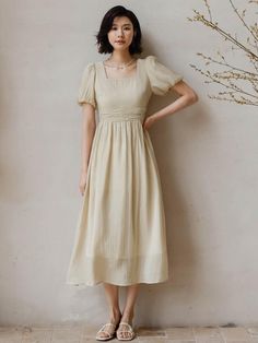 Calf-length, A-line dress. Square neckline and short puff sleeves. Gathers at waist and a flared skirt. Back zip. Lined.- Midi- Short sleeve- A-line Solid A-line Dress With Gathered Sleeves, Beige Fit And Flare A-line Midi Dress, Beige A-line Fit And Flare Midi Dress, Spring Beige A-line Puff Sleeve Dress, Fitted A-line Puff Sleeve Dress With Gathered Sleeves, Chic Midi Dress With Gathered Short Sleeves, Fitted A-line Puff Sleeve Dress, Ruched A-line Midi Dress, A-line Dress With Pleated Sleeves