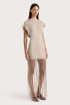 A fitted mini dress, designed from a sheer linen jersey with slight stretch. Featuring a high round neckline and short batwing-style sleeves, it is contoured through the body with a stitch detailing down the front and back. The hem is adorned with handwoven macrame, before falling into an ankle-grazing fringe skirt. Pair with a simple heel or sandal for a unique approach to occasionwear. Maxi Dress Sale, Fitted Mini Dress, Fringe Skirt, Fringe Dress, Faithfull The Brand, Skirt Style, New Arrival Dress, Batwing Sleeve, Special Occasion Dresses