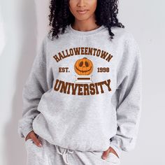 College style halloweentown university halloween sweatshirt. all SKUs Crew Neck T-shirt With University Logo For Fall, Varsity Sweatshirt For Campus Fall Season, Collegiate Fall Campus Sweatshirt, Oversized Fall T-shirt For College, Oversized Fall College Style T-shirt, Oversized College Style T-shirt For Fall, Collegiate Sweatshirt With University Logo For Fall, Fall Fan Apparel Sweatshirt With Graphic Print, College Style T-shirt For Game Day In Fall