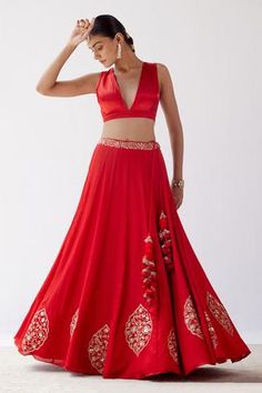 Red lehenga with floral motifs in dori and sequin embroidery. Paired with sleeveless blouse and embroidered sheer dupatta.
Component: 3
Pattern: Embroidered
Type Of Work: Sequins,Dori
Neckline: Plunge V Neck
Sleeve Type: Sleeveless
Fabric: Gajji Silk, Cotton Silk Satin And Silk Organza
Color: Red
Other Details: 
Organza dupatta
Sequin and resham work
Tassel detail
Occasion: Wedding - Aza Fashions Red Sleeveless Choli For Reception, Sleeveless Red Choli For Reception, Red Sleeveless Lehenga For Weddings, Sleeveless Red Lehenga For Wedding, Red Lehenga For Wedding, Sleeveless Red Lehenga For Diwali, Red Sleeveless Lehenga With Zari Work, Red Lehenga For Navratri, Red Floral Embroidered Floor-length Sharara