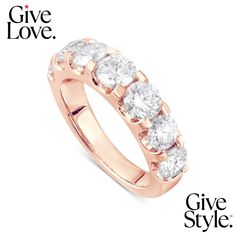 a yellow gold ring with five stones on the side and give love written below it