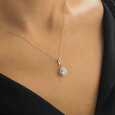 - Solitaire Round Necklace is made with high-quality 925K Sterling Silver. - Dainty, delicate, elegant, charm, cute and trendy round solitaire pendant necklace is a good example for summer jewelry. - 925K sterling silver solitaire round pendant comes with a free 925K Sterling Silver chain and decorated with a round and cubic zirconia stones. - The stone size is 6MM X 6MM, the total size including halo is 9MM X 9MM - You receive CZ halo solitaire necklace in a beautiful and free gift box - Free s Delicate Cubic Zirconia Jewelry With Halo Setting, Dainty Sparkling Diamond White Jewelry, Minimalist Jewelry With Cubic Zirconia In Halo Setting, Minimalist Jewelry With Halo Setting In Cubic Zirconia, Sterling Silver Necklaces With Halo Setting, Fine Jewelry Sparkling Necklaces, Silver Solitaire Necklace With Halo Setting, Classic Sparkling Diamond Necklace Gift, Sparkling Sterling Silver Diamond Pendant Necklace