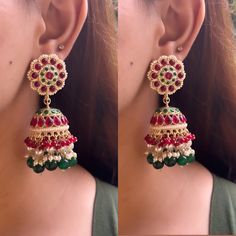 Introducing the most gorgeous and elegant pair of Kundan Jhumka earrings! These earrings are high quality and will adorn your outfit with a look of royalty and elegance. With Pink and Green as the primary colours, these earrings are perfect to make you look class apart. They are light in weight while also being big in size. These earrings are truly a statement piece so grab yours now!  Please feel free to contact us in case of any queries. Happy shopping! Kundan Jhumka Earrings, Outfit Bridesmaid, Kundan Jhumka, Indian Wedding Jewellery, Primary Colours, Earrings Aesthetic, Earrings Indian, Printed Kurti, Indian Wedding Jewelry