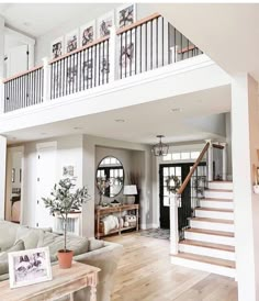 a living room filled with furniture and a staircase