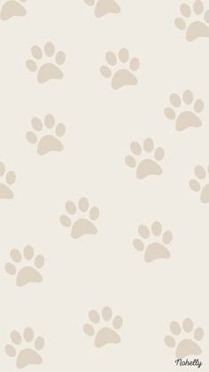 an animal print wallpaper with many paw prints on the side and bottom of it