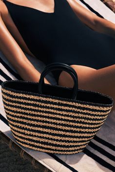 This is not your average raffia bag. Fine craftsmanship elevates our Top Handle Raffia Bag, making it an effortless choice from city to shore. Featuring two Napa leather handles, a zipper closure, and hand-braided raffia - which is locally harvested in the Rwandan countryside. Cesta baskets are handwoven by female artisans in Rwanda, Africa, using locally sourced, renewable resources. Each piece is hand finished in Italy with carefully chosen, sustainable materials. Product Details: 8-12” W x 8” Rwanda Africa, Jenny Bird, Olympia Le Tan, Jane Birkin, Raffia Bag, Basket Bag, Women Artisans, Sustainable Materials, Leather Handle