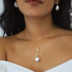 Bronte is a gorgeous mix of timeless classic meets celestial style. She features a pave crystal adorned north star & crescent moon each with a small pearl stone dropped from a gold vermeil chain. Hanging underneath the celestial charms is a large pearl adding a beautiful finishing touch. Bronte would be a perfect choice for lapping up the Summer Sun on a beach somewhere or for a wedding she really is very versatile and if you're looking for something to make a stunning statement then she really Wedding Fine Jewelry Necklace With Moon Charm, Delicate Moon Charm Necklace For Wedding, Delicate Wedding Necklaces With Moon Charm, Delicate Wedding Necklace With Moon Charm, Crescent Moon Phase Wedding Jewelry, Elegant Crescent Necklace For Wedding, Elegant Crescent Wedding Necklace, Fine Jewelry With Moon Charm For Wedding, Elegant Moon Charm Necklace For Wedding