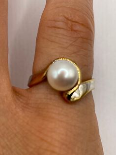 Vintage white cultured pearl  Sterling silver with gold setting   Re sizing has a $20 jeweler's fee. All rings are shipped in a nice gift box.   Check out our over a THOUSAND great reviews Engraving is $4 per letter and is not always perfect depending on the piece. It can take a few days if the jeweler is busy. This is payable to Paypal Judithsltd@gmail.com Formal White 14k Gold Pearl Ring, Polished Finish Pearl Ring As Gift, Classic Round Pearl Ring For Anniversary, Classic Gold Pearl Ring For Anniversary, Heirloom Jewelry With High Luster For Gifts, White Pearl Drop Ring For Anniversary, Gold Pearl Ring With Polished Finish For Anniversary, Heirloom Style High Luster Jewelry For Gifts, Classic White Jewelry With Tension Setting