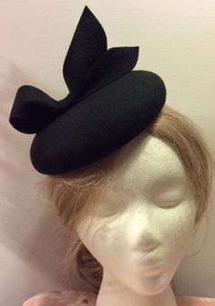 Currently Ready to ship - ship out in 3-5 days. OVERVIEW -------------- This design was inspired by those of Duchess of Cambridge - Kate Middleton's fascinators. This hat would look much better if you wear it on the right side of the head. DETAILED DESCRIPTION --------------------------------- This listing is for a chic handmade 100% Merino wool fascinator hat in BLACK color. It features a cute looped bow - full of elegance and character.  I could make this design in more than 100 colors, just message me or leave me a note during checkout.  Wool fascinators are not just for the royalty or the high society. Everyone looks at their best wearing them and they are appropriate on nearly all occasions. They are not flashy or swanky: instead, they are the embodiment of a timeless elegance back in Classic Black Mini Hats For Party, Handmade Fitted Vintage Fascinator, Fitted Black Hat With Structured Crown, Vintage Black Handmade Top Hat, Handmade Formal Hats, Winter Curved Brim Fitted Fascinator, Black Fitted Felt Hat For Party, Fitted Black Felt Hat For Party, Classic Black Mini Hat For Evening