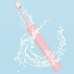 a pink toothbrush with water splashing around it on a light blue and white background