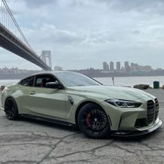 a white car parked in front of a bridge