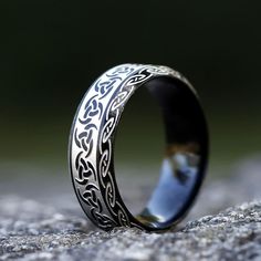 When worn, Odin's Horn Viking Ring is believed to have miraculous powers such as healing and protection against evil spirits. It is also thought to bring fortune and success in battle. The natural curved shape of the ring signifies the Horn of Odin, which was said to give off a great blast when blown by the Norse god himself. The Viking Ring is made from premium-quality stainless steel. It has an eye-catching and will never tarnish or oxidize. Great for men and women, it makes a great gift for l Spiritual Black Jewelry For Promise, Symbolic Black Stainless Steel Rings, Black Viking Engraved Jewelry, Adjustable Engraved Black Ring, Rune Ring, Nordic Symbols, Mjolnir Pendant, Runic Alphabet, Horn Ring