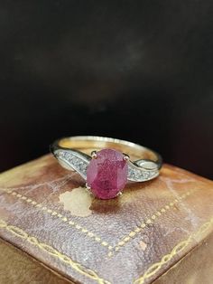 This beautiful decorative ring has great modern style featuring natural ruby and diamond gemstones set in 9ct yellow gold.  Message me any questions Dazzling Pink Ruby Gemstone Ring, Antique Hallmarked Ruby Signet Ring, Dazzling Brilliant-cut Ruby Ring For Gift, Antique Ruby Cabochon Ring Gift, Elegant Pink Ruby Cabochon Ring, Coral Ring, Ruby Gemstone, Pretty Rings, Natural Ruby