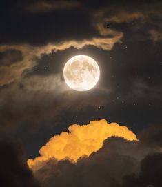 the full moon shines brightly in the night sky with clouds and stars around it