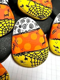 painted rocks are arranged on top of each other