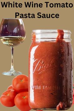 white wine tomato pasta sauce in a jar next to tomatoes and a glass of wine