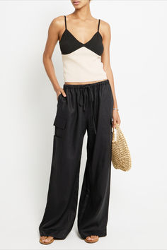 With its oversized, relaxed fit and long loose legs, these pants are a comfortable and cool choice for any occasion. The adjustable drawstring waist and cargo pocket details add both function and fashion to this must-have piece. Wide Leg Parachute Pants With Pockets For Vacation, Relaxed Fit Cargo Pants With Side Pockets For Vacation, Casual Linen Parachute Pants With Cargo Pockets, Linen Cargo Pants With Pockets For Loungewear, Relaxed Fit Wide Leg Parachute Pants For Vacation, Wide Leg Linen Cargo Pants For Loungewear, Summer Wide Leg Cargo Pants For Loungewear, Wide Leg Summer Cargo Pants For Loungewear, Wide-leg Cargo Pants With Pockets For Vacation