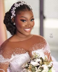 a woman in a wedding dress holding a bouquet