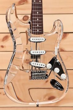 an electric guitar made out of clear plastic