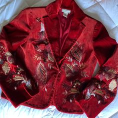 Embroidery Is On The Front Of The Blazer, On The Back And On The Sleeves. Ticking Around The Outline Of The Blazer, Around The Collar. Deep Red/Multicolored. And Very Good Condition. Vintage Red Outerwear With Floral Embroidery, Red Vintage Outerwear With Floral Embroidery, Winter Formal Blazer With Floral Embroidery, Festive Fitted Outerwear With Multicolor Embroidery, Festive Fitted Multicolor Embroidered Outerwear, Red Festive Outerwear For Fall, Vintage Embroidered Blazer For Formal Occasions, Festive Fitted Outerwear With Floral Embroidery, Formal Fall Outerwear With Floral Embroidery