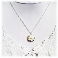 "Handcrafted Easter Lily Locket Necklace featuring hand sculpted white flower and a filigree backdrop on a shiny silver tone locket. -Locket : 2cm (approx. 3/4 inch) silver-plated locket -Interior Locket (for photo) : 13mm (1/2 inch) -Cable Chain : Choose silver plated or upgrade to 925 sterling silver -Length : Choose 16\" or 18\" cable chain View matching collection at: https://www.etsy.com/shop/strandedtreasures/search?search_query=easter+lily Flowers are hand sculpted without molds or paint Sterling Silver Birth Flower Medallion Jewelry, Delicate Silver Flower Charm Necklace, Silver Delicate Flower Charm Necklace, Silver Birth Flower Jewelry As A Gift For Her, Silver Medallion Necklace With Birth Flower, White Gold Flower Jewelry For Birth Flower, White Gold Flower Jewelry With Birth Flower Detail, White Gold Flower Jewelry With Birth Flower, White Gold Birth Flower Jewelry