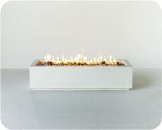 a white box with flames in it on a table