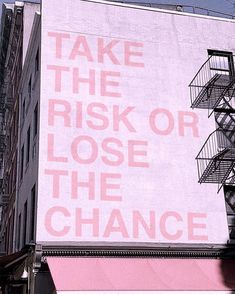 an advertisement on the side of a building that says take the risk or lose the chance