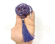 Handmade Customized 108 Beads Mala/Necklace with Natural 8mm Amethyst Gemstone - Guru Bead German Silver Hand-Knotted Mala Comes with unbreakable finishing.  ⩥Materials Used:  8mm Natural Amethyst ⩥Guru Bead: German Silver Bead ⩥Length: 18-20 inches  ⩥End Work Length: 3-4 Inches ⩥Thread color: Navy Blue Color (Any color of threads is available) Any kind of Customization is available. ✅This beautiful Amethyst Stone bead mala is hand-knotted on a bright & and Shine Navy Blue Colour thread to add longevity and comfort during meditation and finished with a Shining German Silver guru bead and a matching Contrast Navy Blue Colour silk tassel.✅ ↈ Chakra of Stone Used:  ⩥ Amethyst- Third Eye Chakra ⩥ABOUT AMETHYST STONES & USES  ✨Enhancing the immune system. ✨Improving endocrine function. ✨Improvi Purple Beaded Necklaces With 8mm Beads As Gift, Purple Beaded Necklaces With 8mm Beads For Gifts, Purple Beaded Necklace With 8mm Beads As Gift, Gemstone Beads Mala As Gift, Round Gemstone Beads Mala As Gift, Adjustable Mala With Polished Beads As Gift, Buddhist Mala, Knotted Mala, Beads Mala