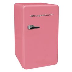 a pink refrigerator freezer sitting on top of a white floor next to a wall