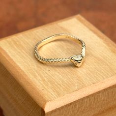 14KT yellow gold snake wave band ring with diamond eyes. Size 7 May be doable in other sizes Weight: 2.22 grams Band width: 2.1mm Solid 14k gold (2) diamonds; 1 on each eye Genuine diamonds Yellow Gold Snake-shaped 14k Gold Rings, 14k Gold Snake Shape Ring For Anniversary, Gold Snake-shaped Diamond Ring For Anniversary, 14k Gold Snake Ring For Anniversary, Adjustable 14k Gold Snake Ring For Anniversary, Fine Jewelry Yellow Gold Snake Ring For Promise, Adjustable Yellow Gold Snake-shaped Ring, Adjustable Snake Ring In Yellow Gold, Saint Jewelry