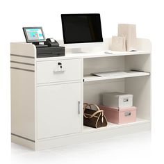 a computer monitor sitting on top of a white desk