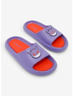 two purple and orange slides with cats on the front, one in an orange bottom