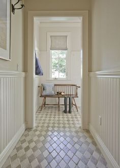 the hallway is clean and ready to be used as a place for someone to sit