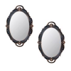 two mirrors are shown with ornate designs on the sides and one mirror has an oval frame