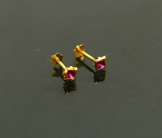 18 kt or 18 carat yellow gold handmade excellent single stone stud earring multi purpose stud we can use as nose pin also. Fabulous bridesmaid , customized personalized unises jewelry from india.Metal-18 kt yellow gold.Item type-stud earring/nose pin.Weight-0.200 grams.size-3.5 mm approxClosure- screw back.Makes excellent gifting for birthday,mother's day. valentines day, Christmas day, wedding anniversary. Gold Plated Piercings As Gift, Dainty Yellow Gold Nose Studs For Gift, Dainty Yellow Gold Nose Studs As Gift, Dainty Hypoallergenic Yellow Gold Nose Stud, Fine Jewelry Yellow Gold Piercings For Gift, Dainty Internally Threaded Yellow Gold Nose Studs, Dainty Yellow Gold Internally Threaded Nose Studs, Tiny Yellow Gold Round Nose Studs, Dainty Yellow Gold Nose Studs