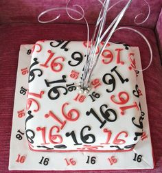 a square cake decorated with numbers and arrows